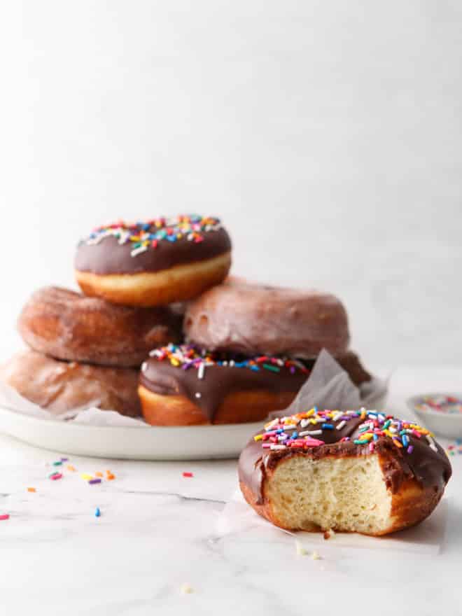 yeast-raised doughnut with a bite out of it