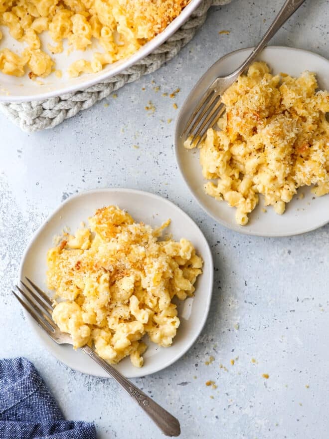 baked macaroni and cheese on plates with forks