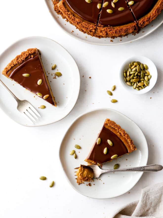 taking a forkful of chocolate pumpkin tart slices