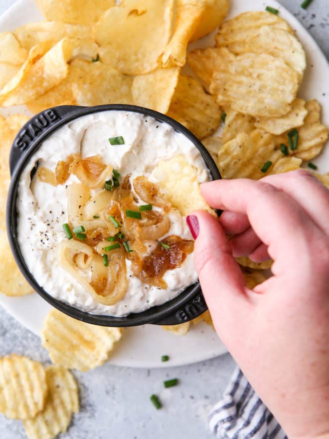 dipping chips in french onion dip