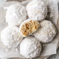 snowball cookies with bite taken out of one