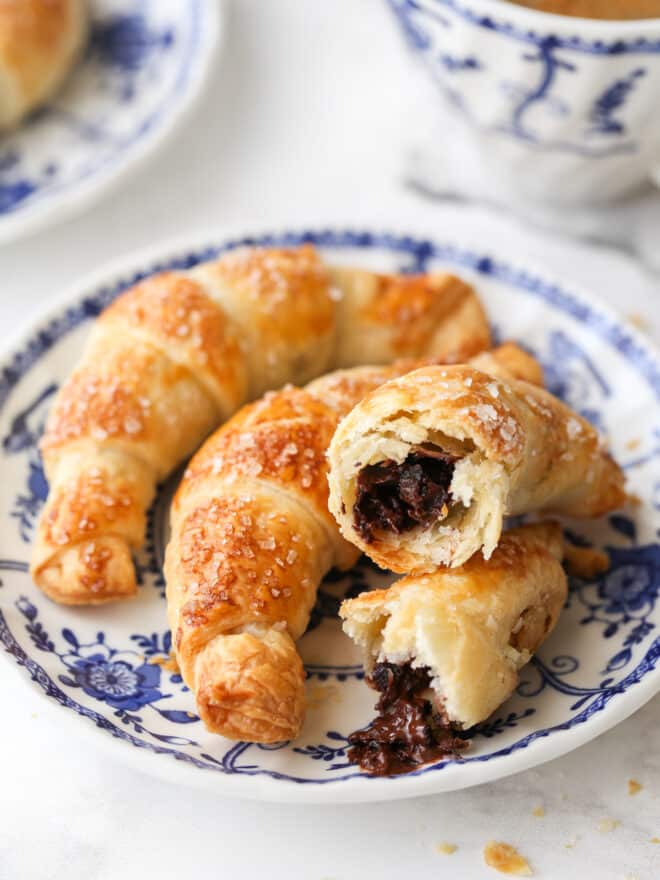 closeup of puff pastry chocolate croissants on a plate