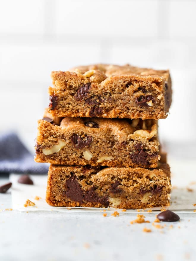 baked whole wheat chocolate chip cookie bars stacked together