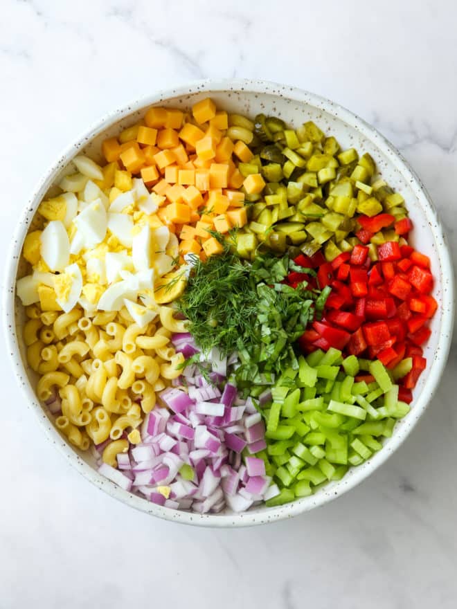 all ingredients for macaroni salad in a bowl