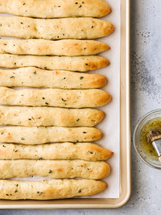 breadsticks fresh from the oven brushed with garlic herb butter