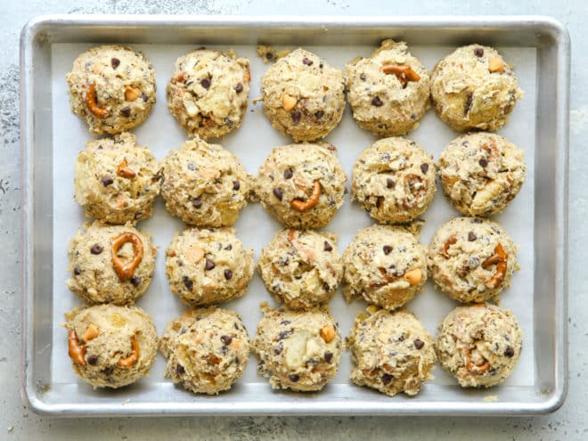 scooped kitchen sink cookie dough on a sheet pan