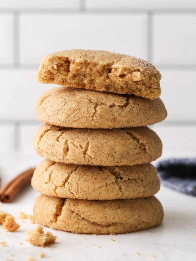 brown butter snickerdoodles in a stack with one in half