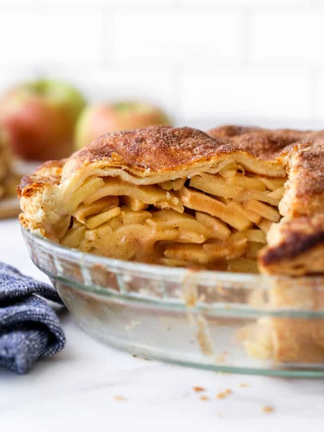 closeup of cut mile high apple pie in pan