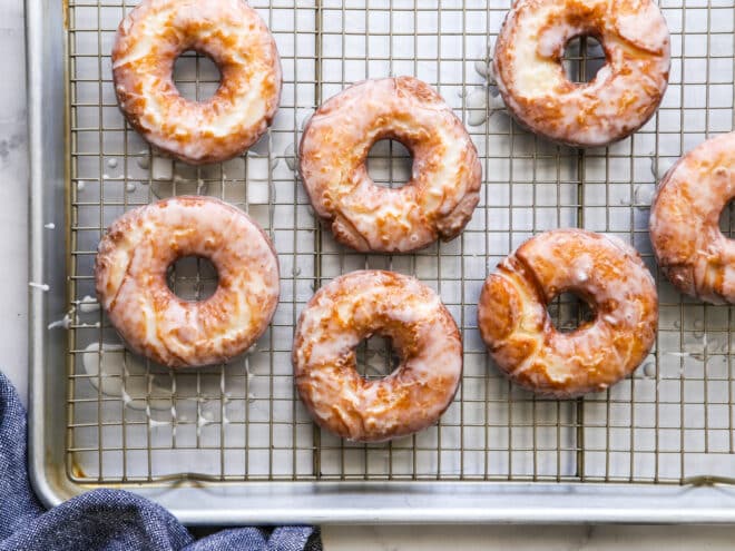 glazed old fashioned doughnuts on a wire rack