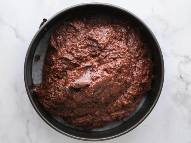 flourless chocolate cake batter in pan