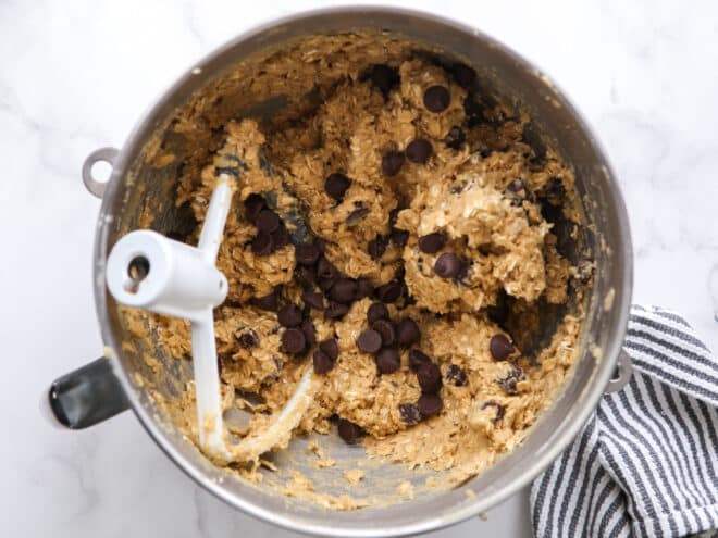 chocolate chip oatmeal cookie dough in mixer bowl