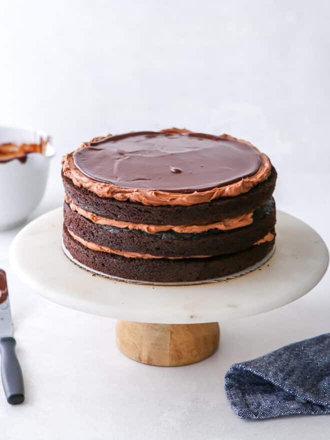 assembling chocolate fudge layer cake