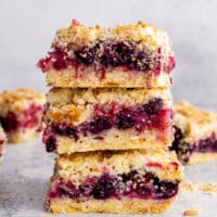 berry crumb bars stacked on top of each other