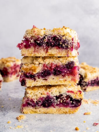 berry crumb bars stacked on top of each other