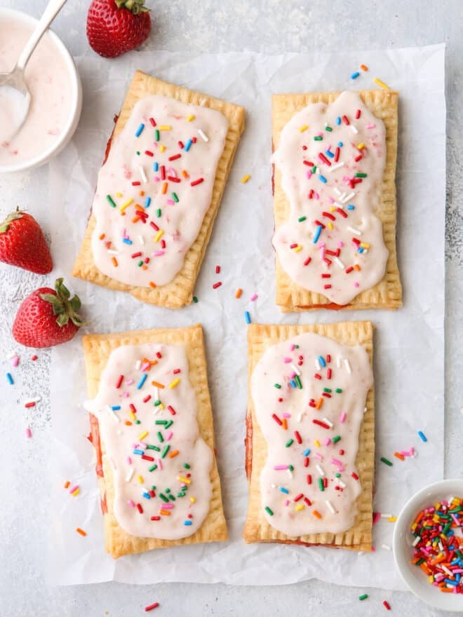 baked strawberry pop tarts with frosting and sprinkles