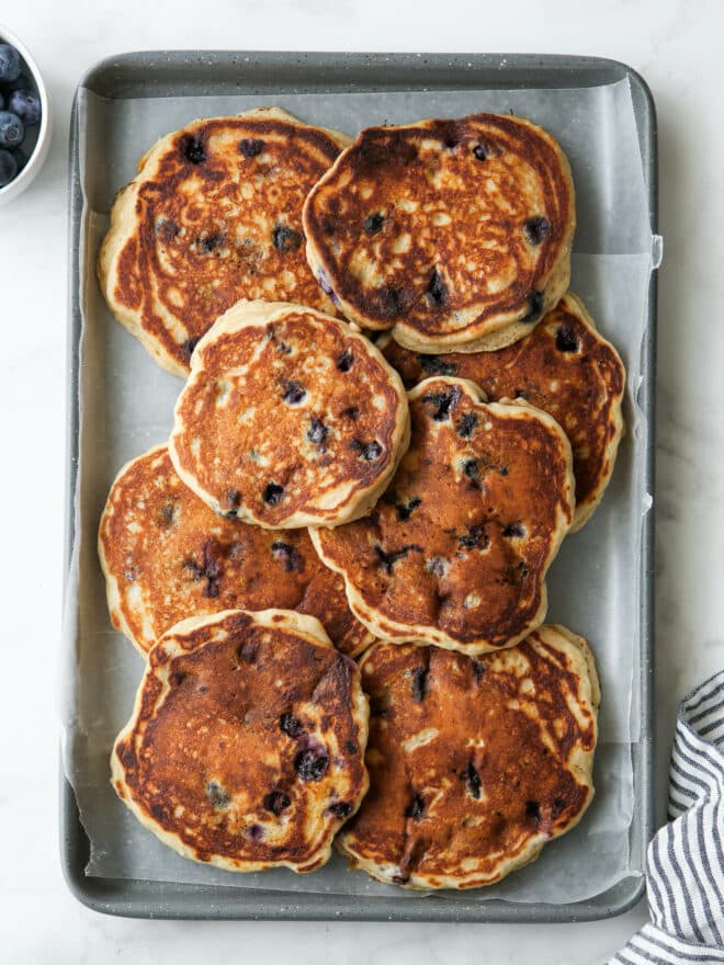 blueberry pancakes on a baking sheet pan