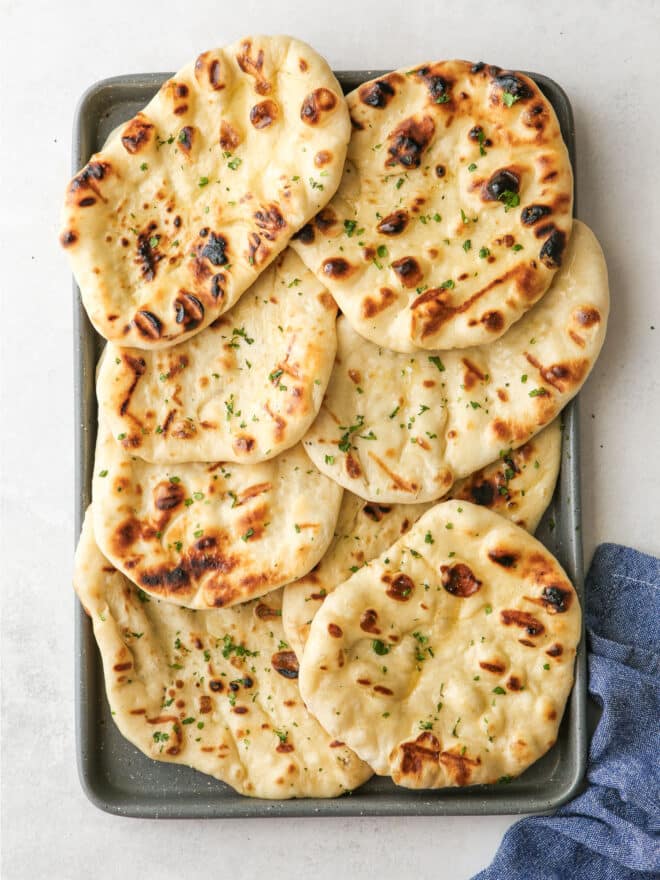 grilled flatbread on a baking sheet pan