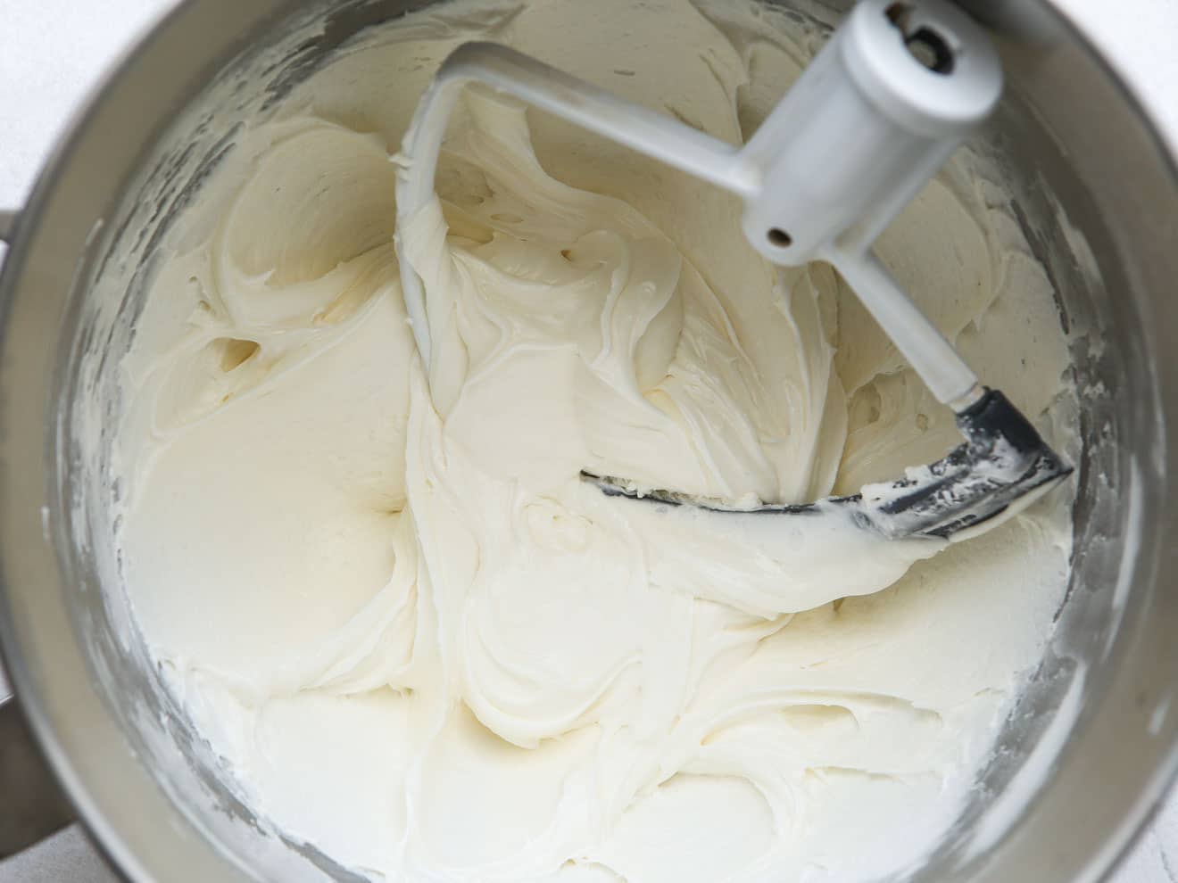 marshmallow cream frosting in mixing bowl