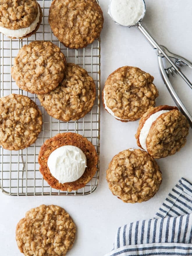 assembling oatmeal cream pie with cookies on rack