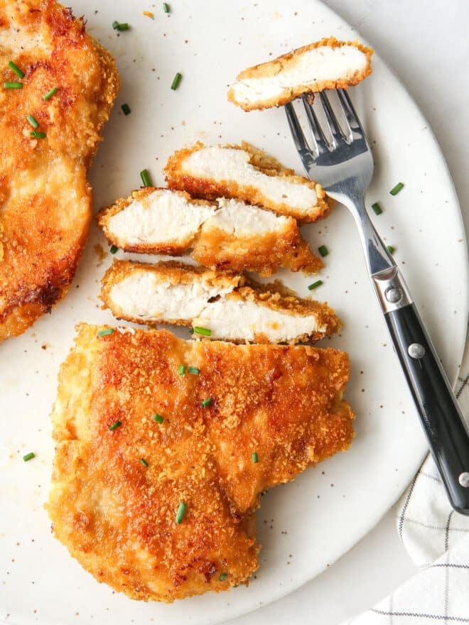 sliced oven fried chicken with fork