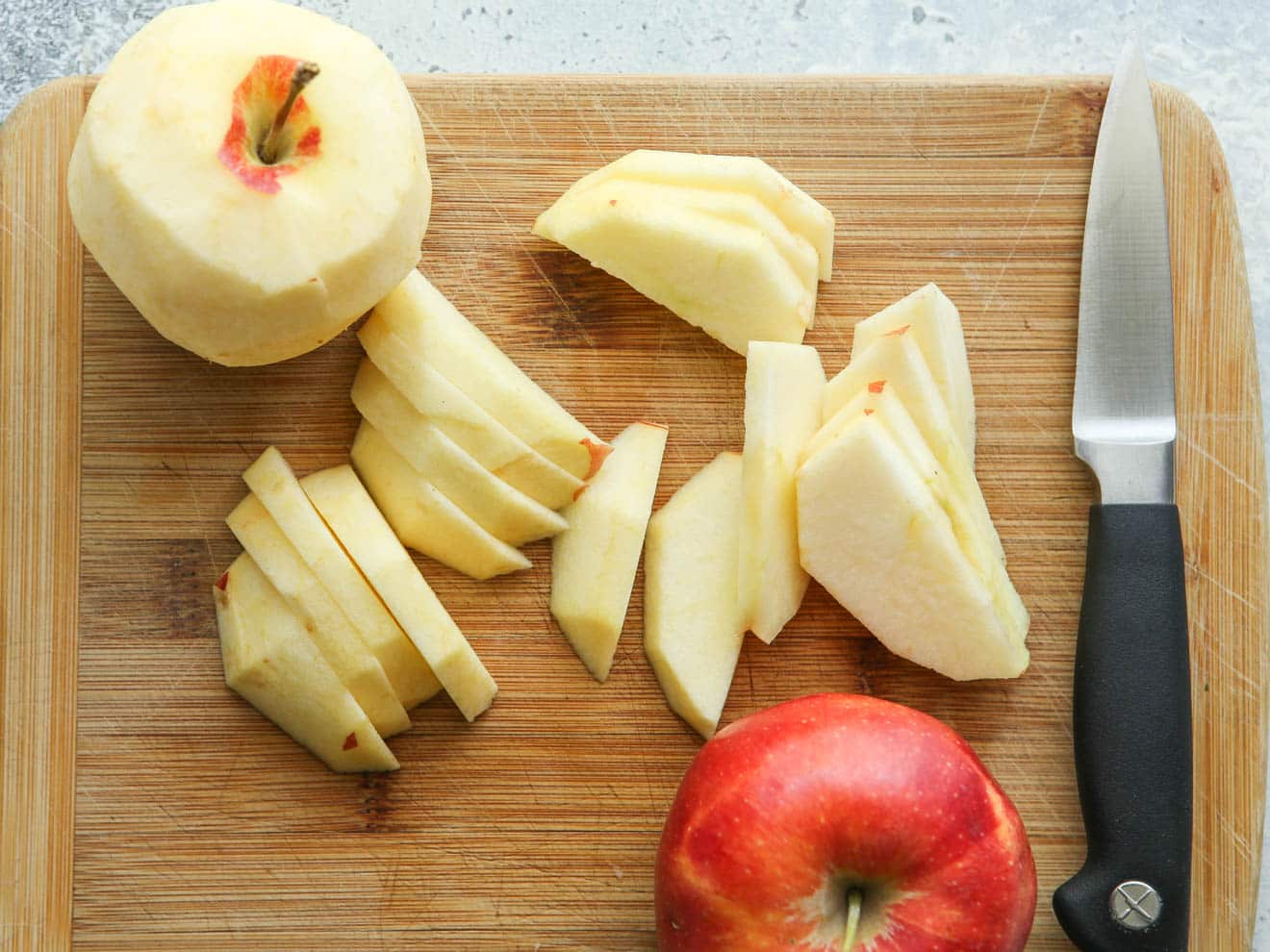 slicing apples on a cutting board
