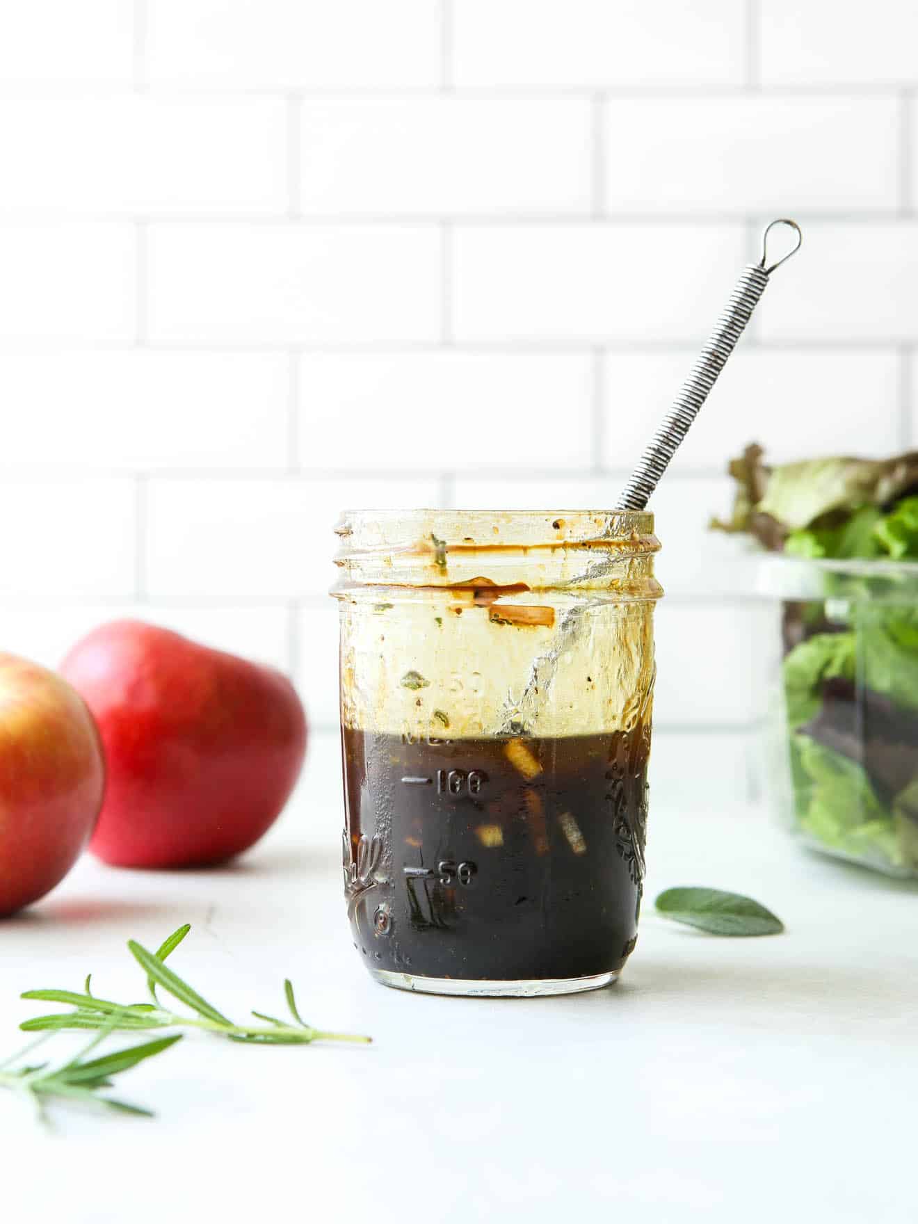 maple balsamic vinaigrette in a jar with whisk