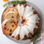 cranberry orange bundt cake and slices on a plate