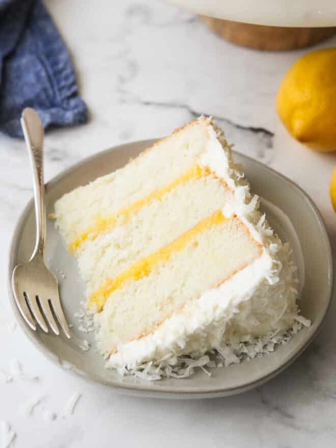 closeup of a slice of lemon coconut cake on a plate