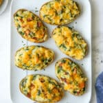 spinach and cheddar twice-baked potatoes on a large white platter