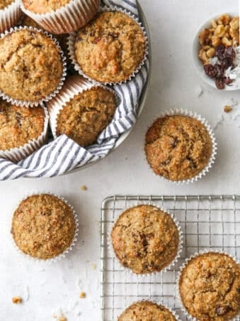 bran muffins in a bread basket and cooling rack
