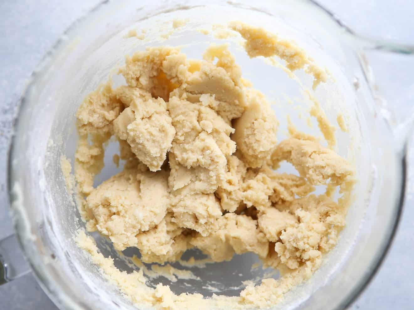 mixed sugar cookie dough in mixing bowl