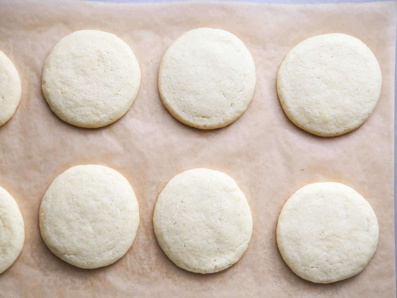 baked sugar cookies on sheet pan
