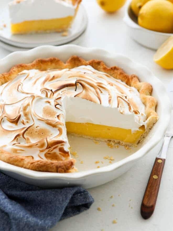 slice taken out of lemon meringue pie in dish