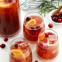 holiday punch in individual glasses with pitcher in background