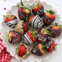 chocolate covered strawberries on a pretty plate