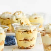 many individual banana pudding cups on counter